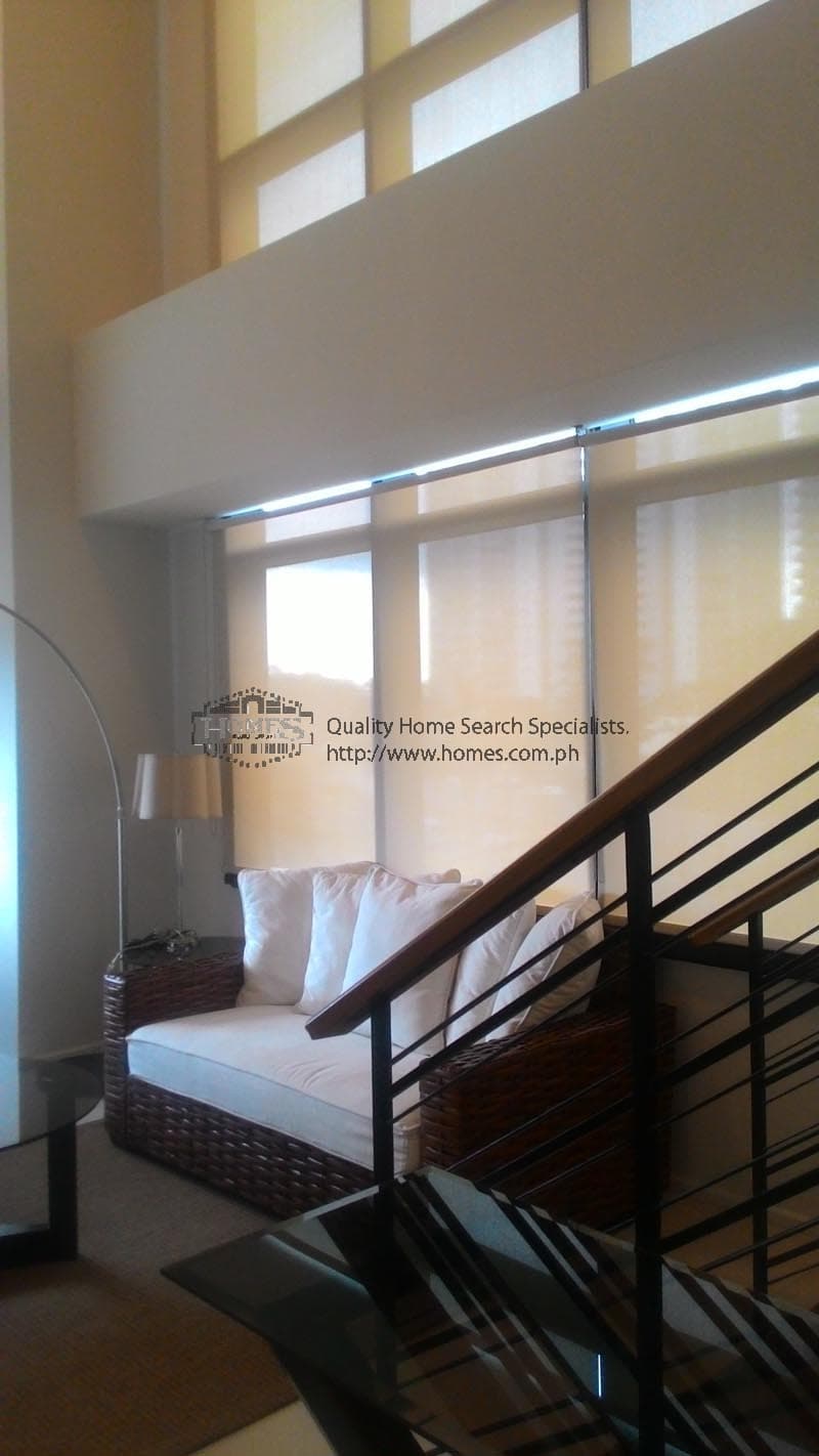 Fully furnished 2-bedroom condominium at Arya Residences - photo 2
